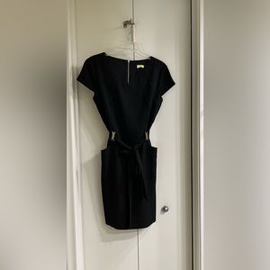 Very flattering little black dress, like new, perfect for work or dinner.